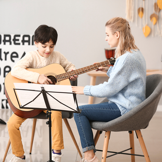 Guitar Lessons for Kids vs Adults