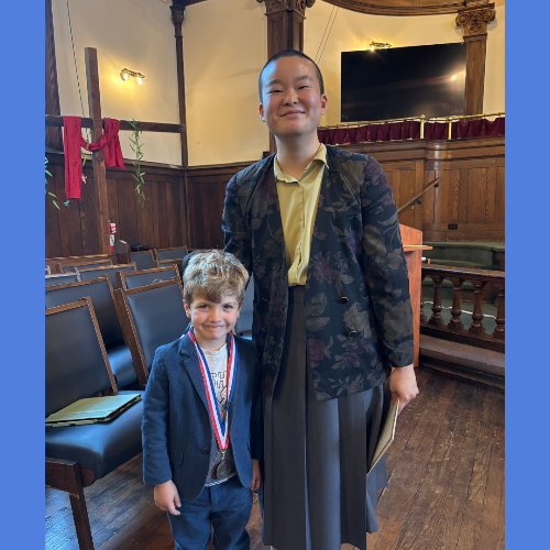 Teacher and boy smile
